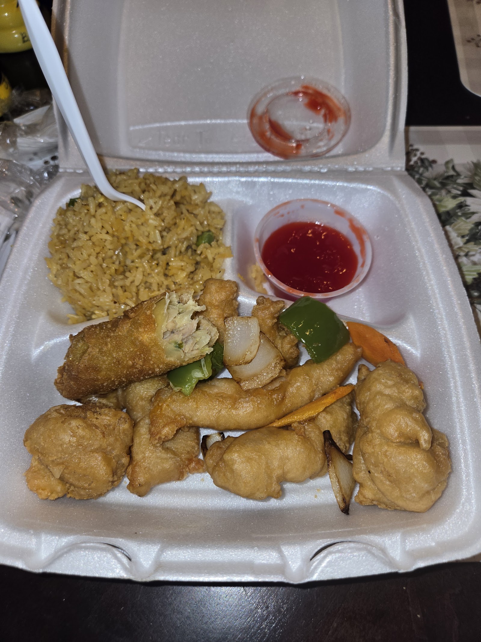 Combination platter with fried rice, egg roll and stir-fried chicken