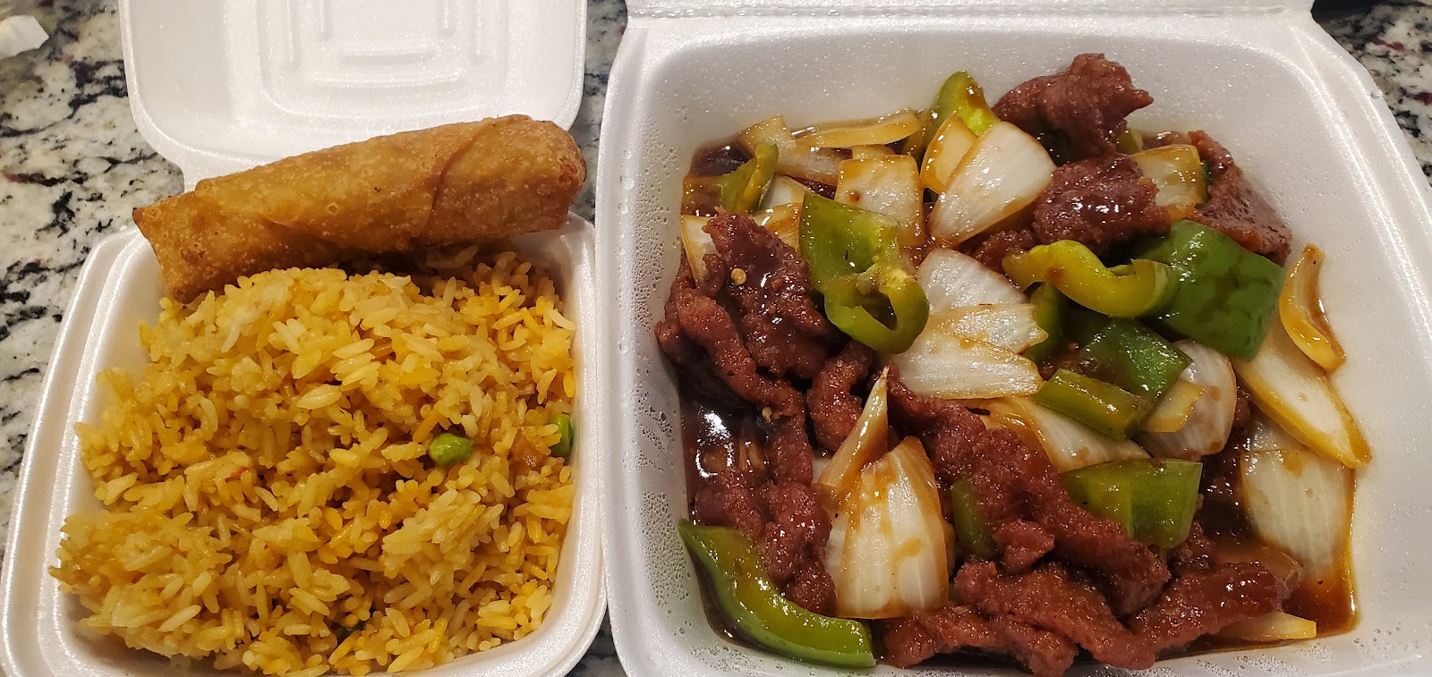 Pepper steak with onions and green peppers, egg roll and fried rice